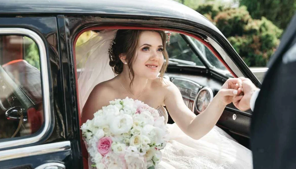 NYC Limo Articles 10 Bride making her wedding entrance from a limousine, showcasing ZechionRide’s luxury wedding transportation services in NYC.