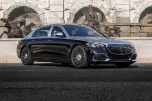 NYC Airport Transfers with ZechionRide – Reliable, Premium & Stress-Free Travel (2025 Guide) 5 Luxury limo parked by a fountain, showcasing luxury and elegance for NYC limo service and executive sedan transfers.