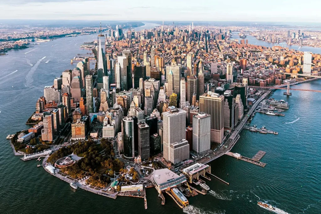 Drive With Us 1 Bird's-eye view of New York City, featuring the diverse architecture and dynamic layout of the metro area
