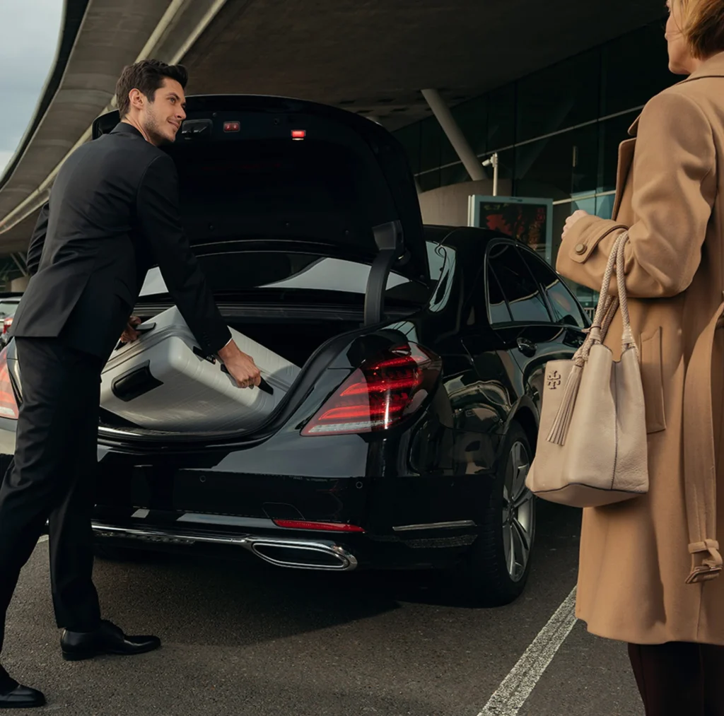 Airport Transfers 1 Man in a black suit, representing luxury airport transfer services in New York City