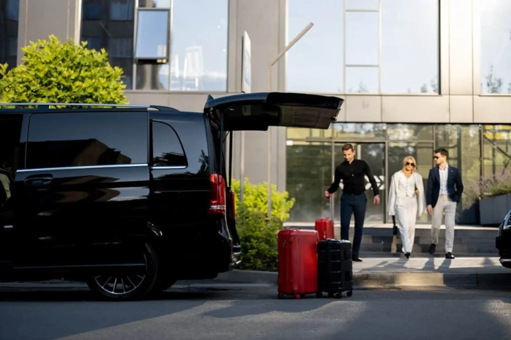 Limousine Packages 7 People walking toward a black van, which is designated for hotel limo transfers