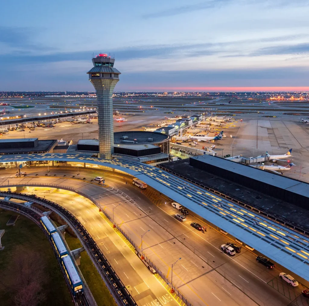 Chicago 5 A Chicago airport featuring a large control tower and a runway, highlighting major transportation hubs in the city