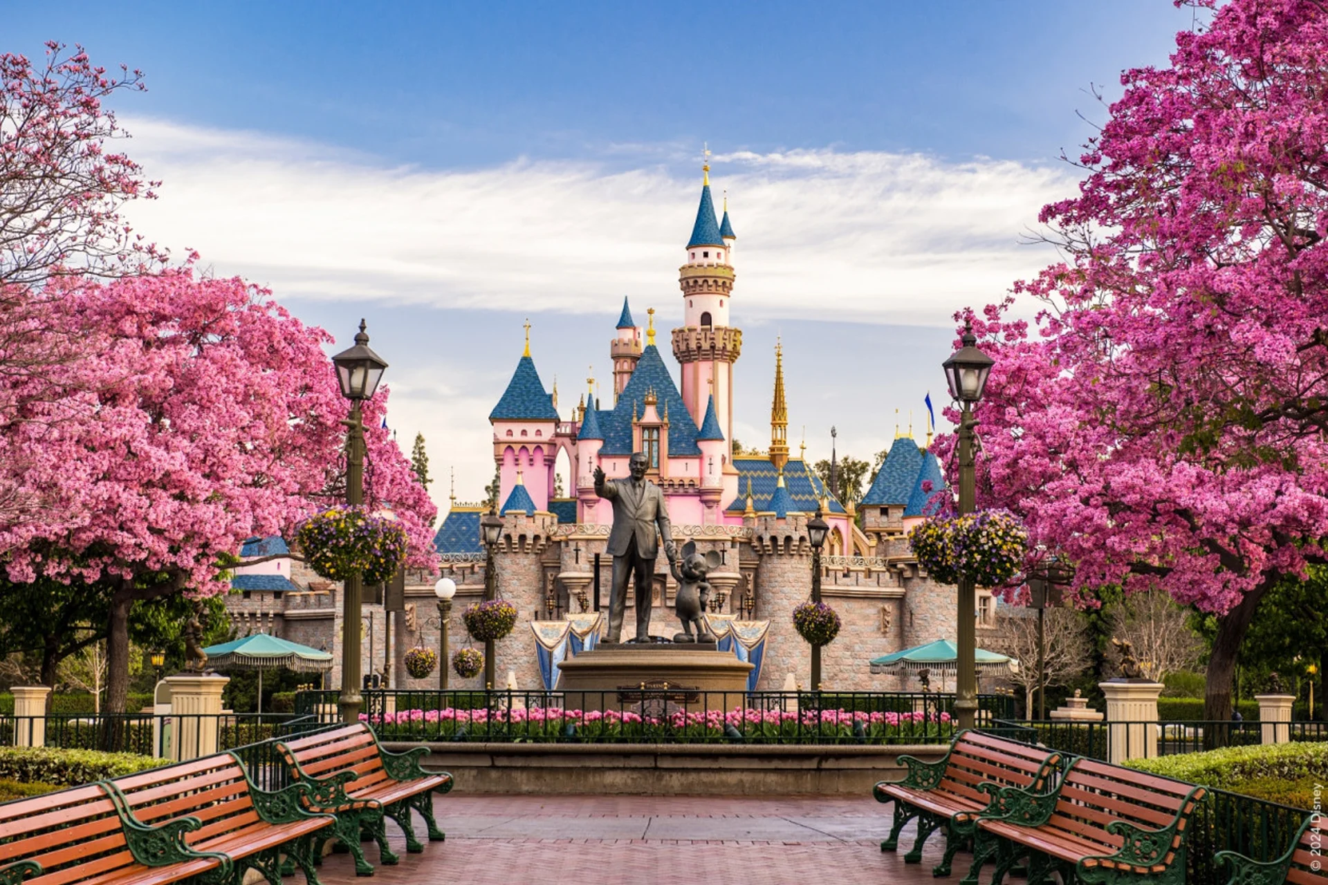 Los Angeles 15 Disneyland Resort in Los Angeles features a castle with a decorative statue positioned in front of it