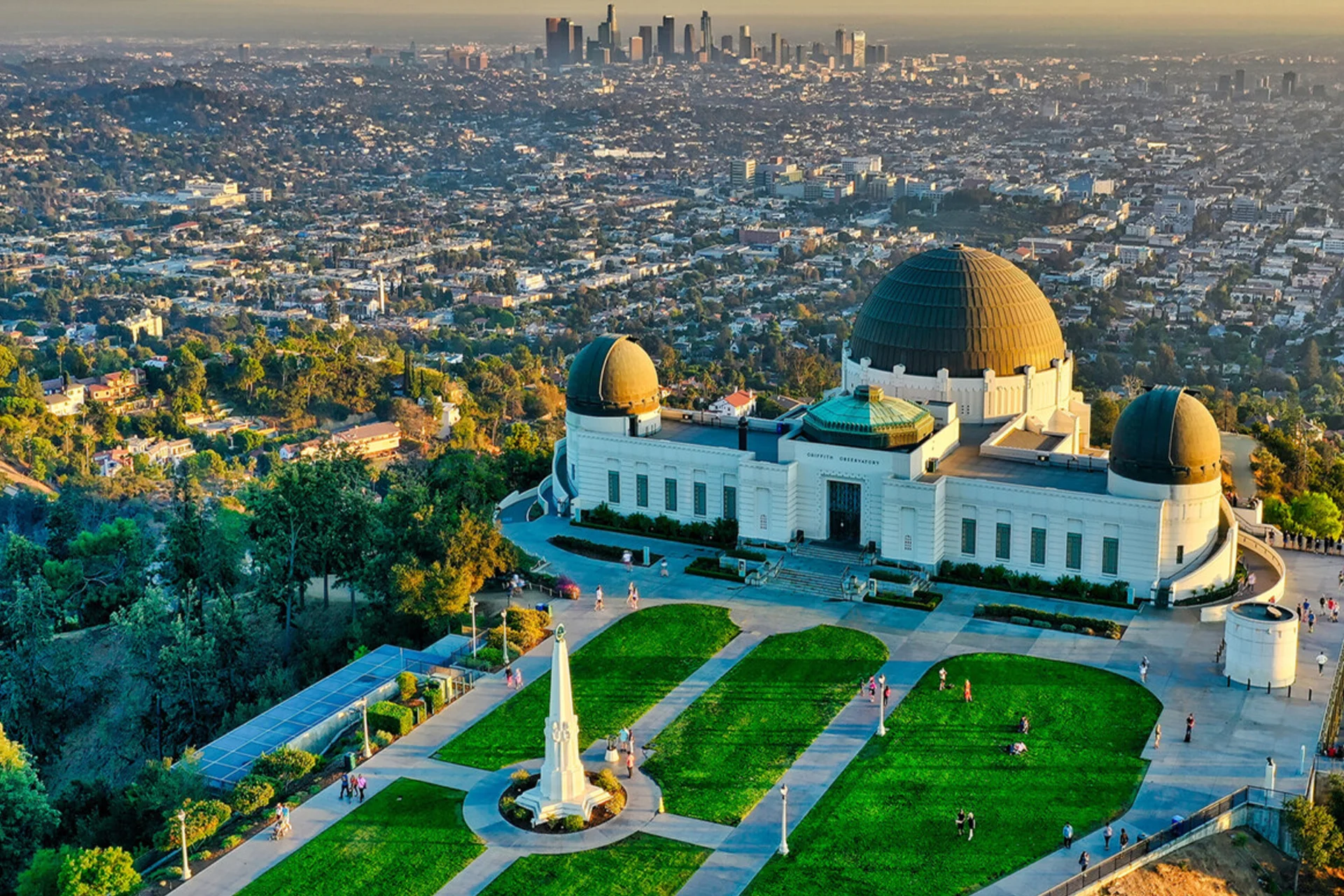 View of Griffith Park and the Los Angeles skyline, featuring the iconic Griffith Observatory in the foreground