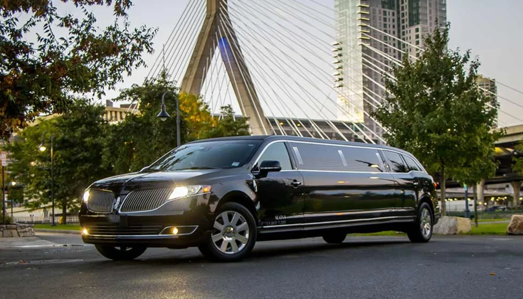 Florida Luxury Limousines vs. Traditional Transportation 7 Sleek black limousine drives along a road, symbolizing luxury transportation in Florida