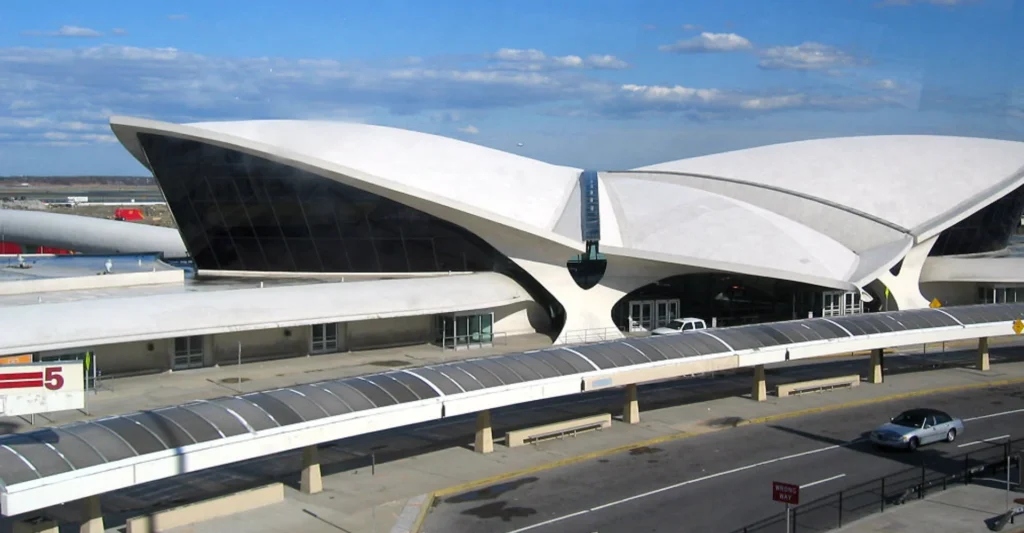 About Us 26 Spacious white building situated in the New York and Tri-State Area, highlighting its striking architectural features